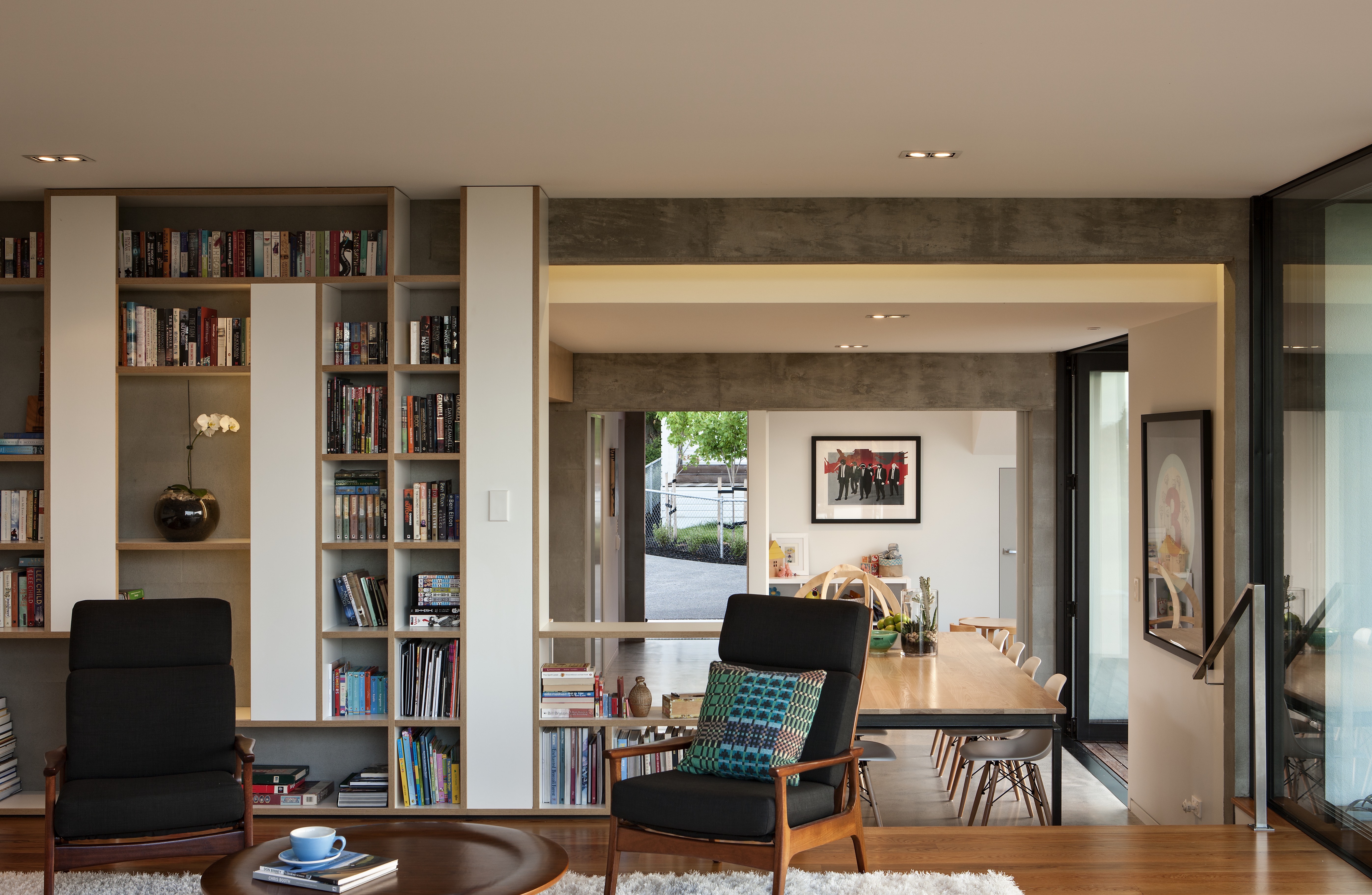 In this home, an interior dividing wall was built to give some privacy in the lounge. Making it extra deep allowed storage to be built-in